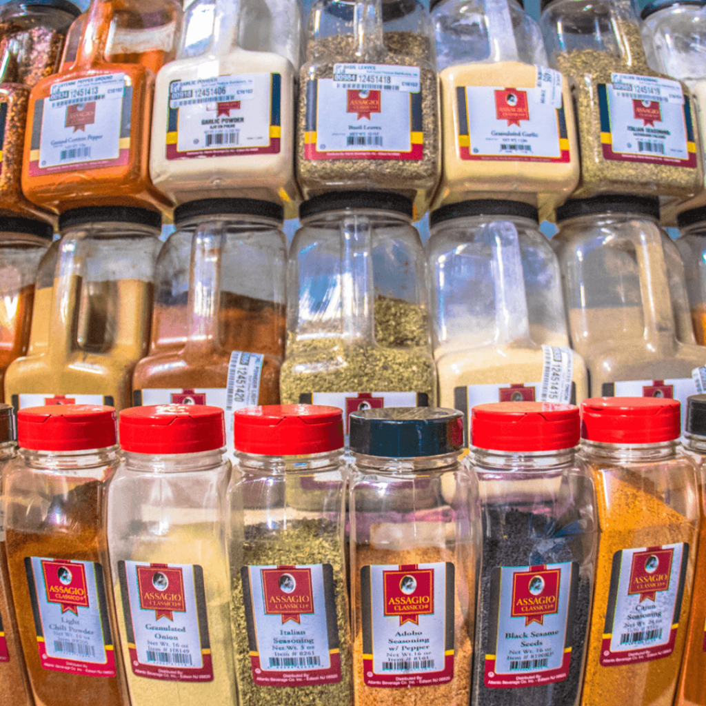 Several containers of herbs, spices, and seasonings